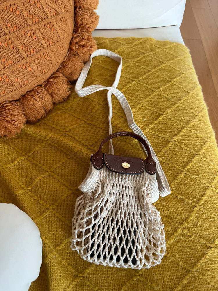 Longchamp net bag .Size:S:18X17cm,L:38x31cm.